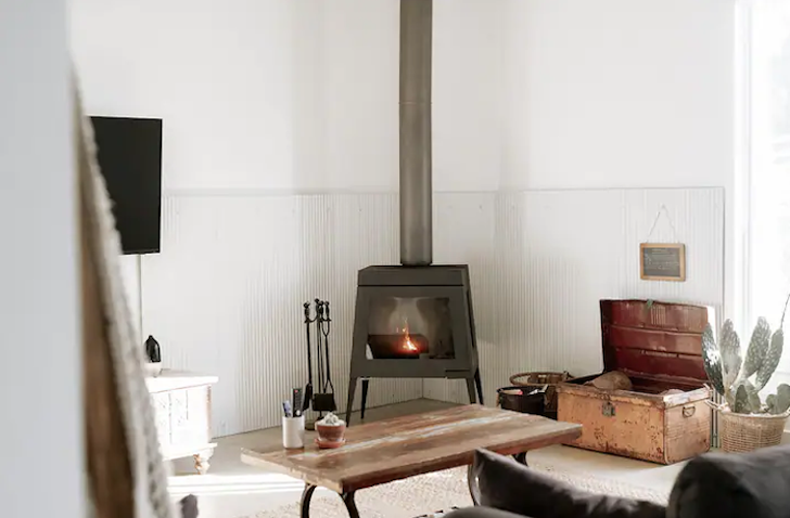 A view of the indoor fireplace at The Barn Yarra Valley, Victoria