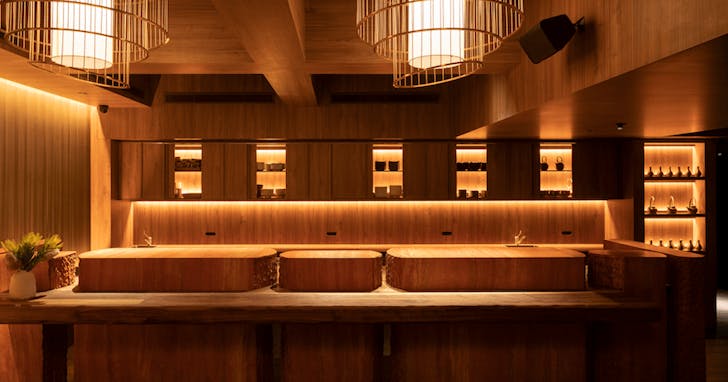 A large wooden omakase bar at a top private dining room Melbourne. 