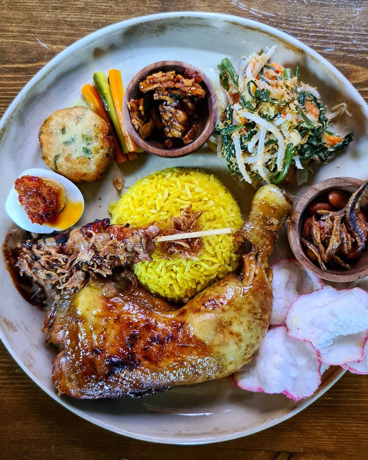 A plate filled with different delicacies of a best Indonesian restaurant Melbourne. 