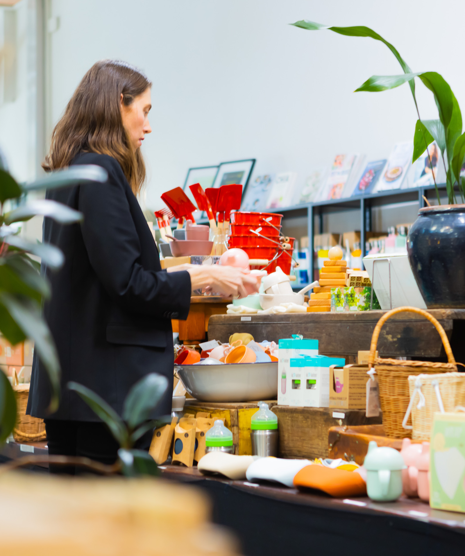 Emma arranging products in Zero Store.