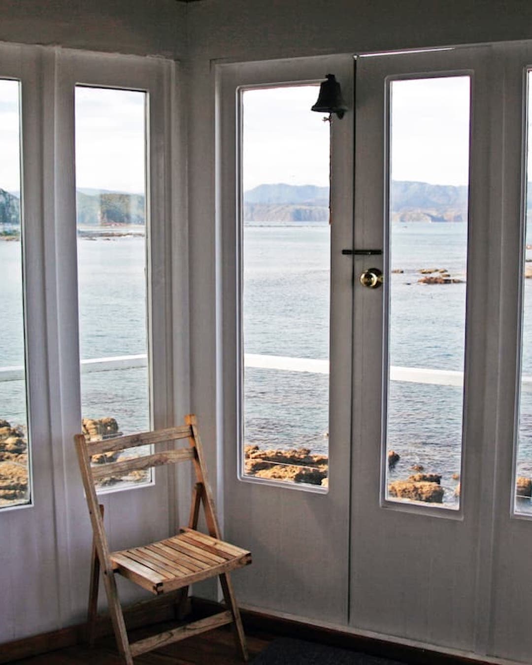 One of New Zealand's best Airbnbs: a converted lighthouse overlooking a bay