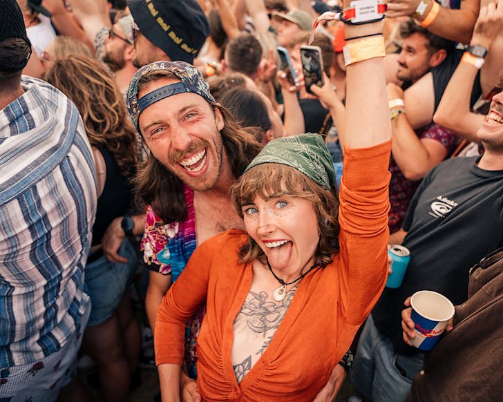 Two festival-goers have big grins at Rhythm & Alps.