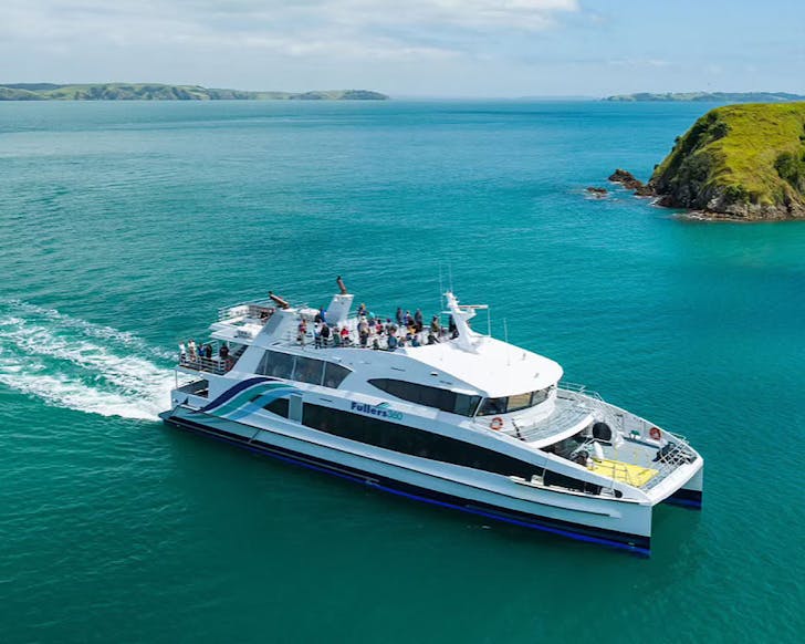 An aerial shot of people taking a Fullers ferry to Waiheke on a beautiful sunny day.