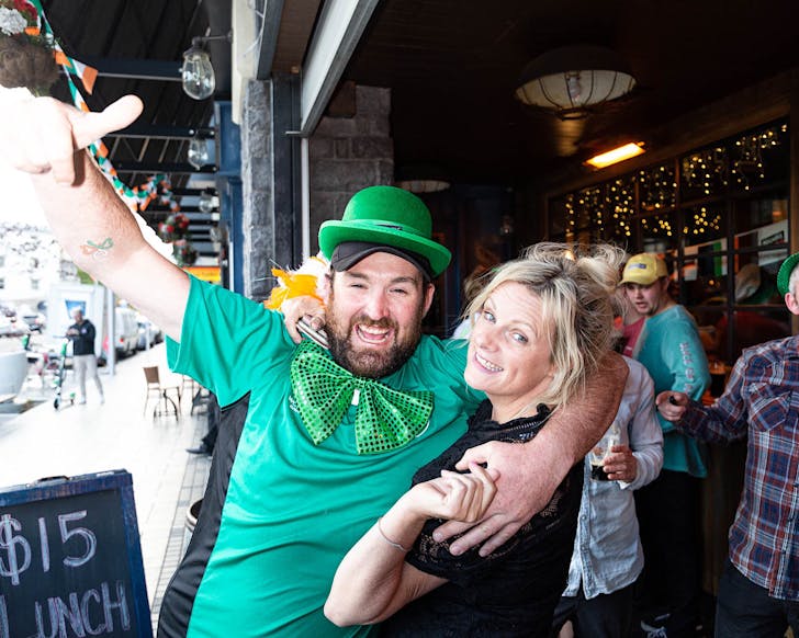 Happy people celebrate St. Patrick's Day at The Bog Irish Pub.