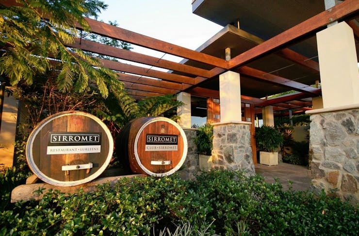 Wine barrels sit at the front of Sirromet Winery.