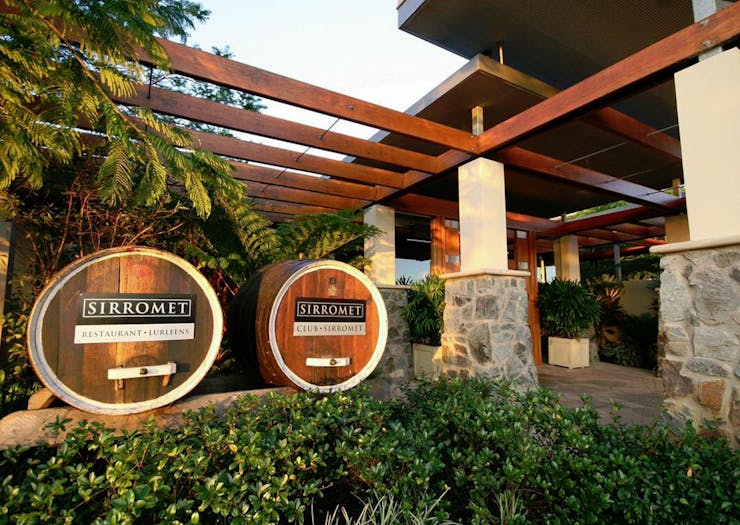 Wine barrels sit at the front of Sirromet Winery.