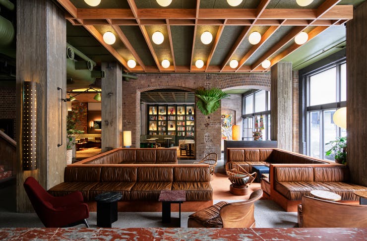 Leather couches in the restaurant at Ace Hotel Sydney