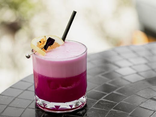 a pink frothy cocktail