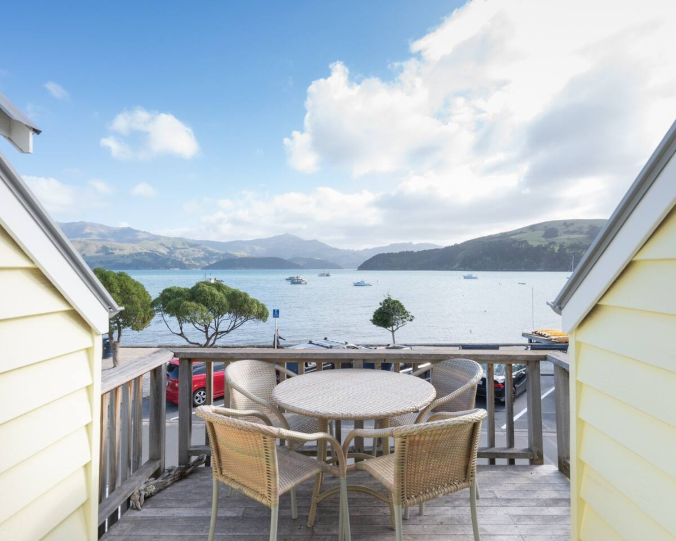 The balcony of this Akaroa stay looks out over the tranquil waters
