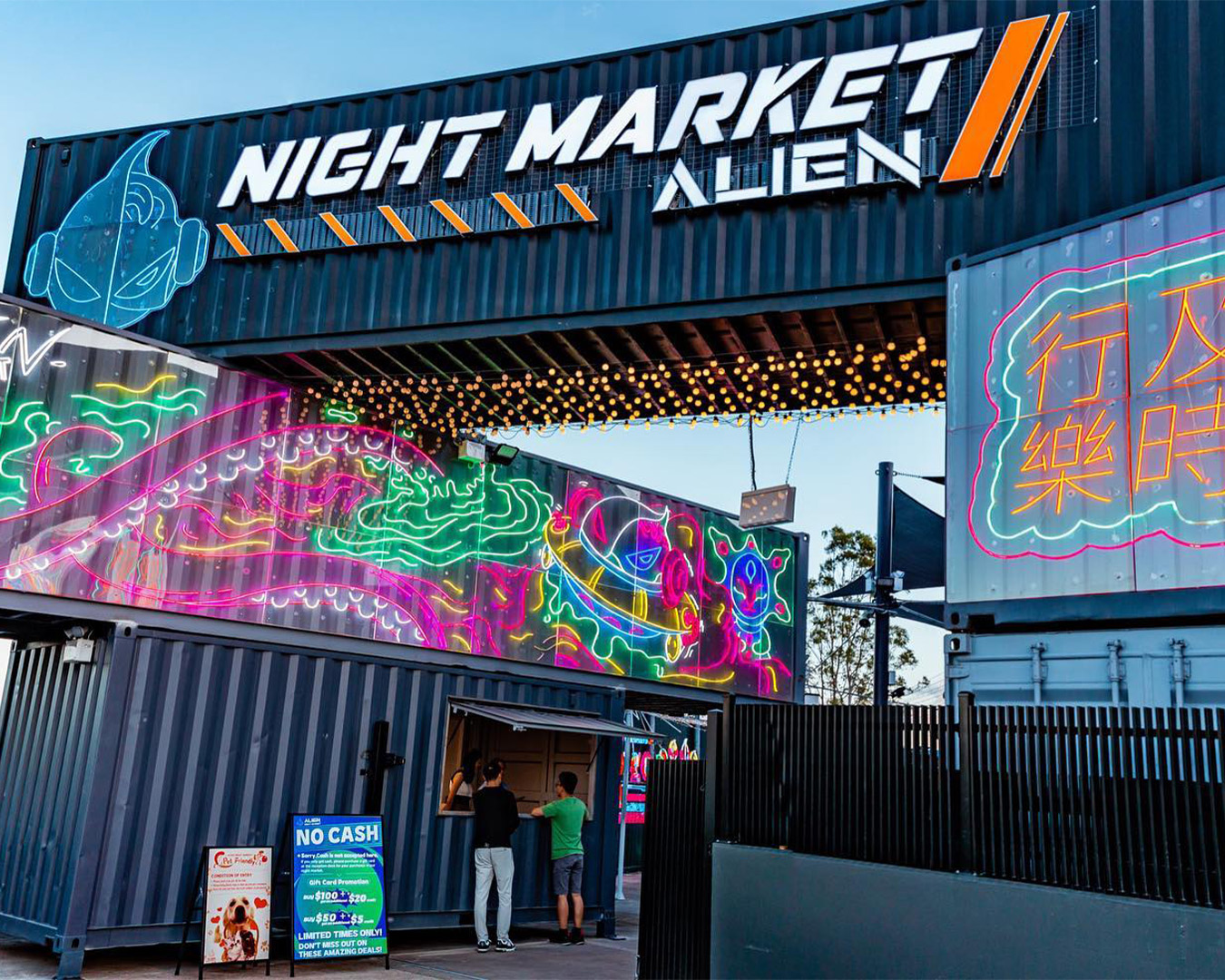shipping containers marking the front entrance of alien night market brisbane