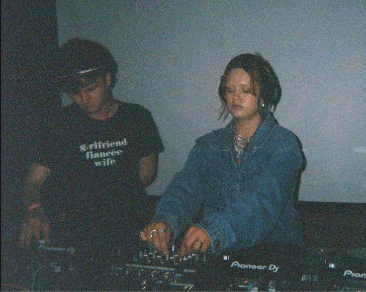 DJ Foxtrot at the decks, a grainy photo.
