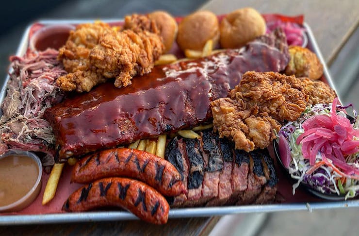 a tray of American bbq meats and sides