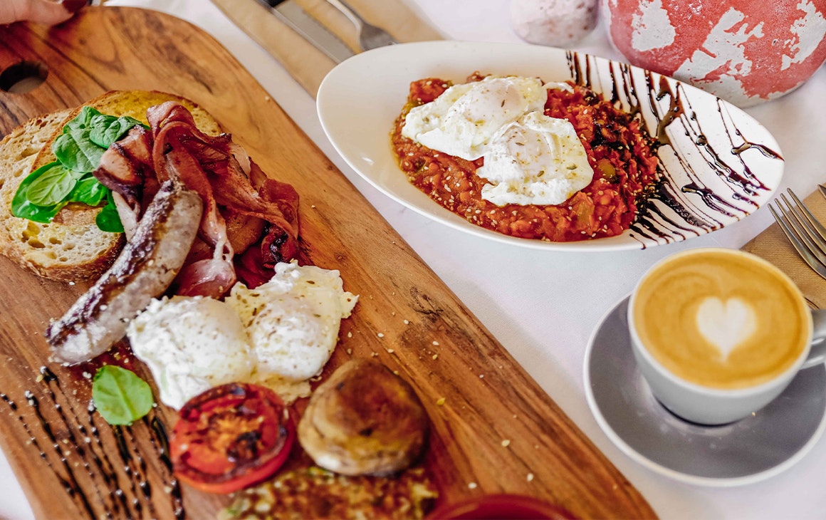 spread of breakfast dishes at ant and ola