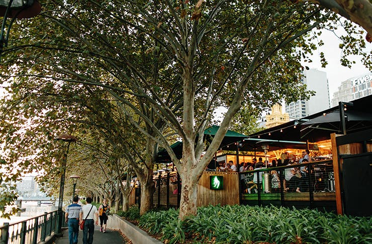 Melbourne's Arbory bar filled with people drinking and socialising by the Yarra River.