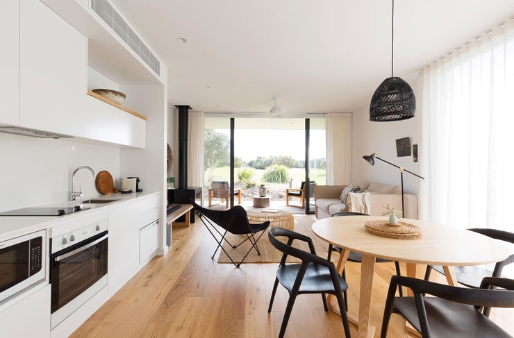 The kitchen and lounge inside one of the luxury villas at Bangalay Villas. 
