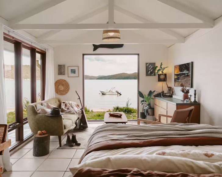 A river-side airbnb, Banskia Boathouse, looks out onto the waters of the Hawkesbury