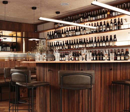 Bar stools surround the horseshoe shaped bar at Bar Heather in Byron Bay. 