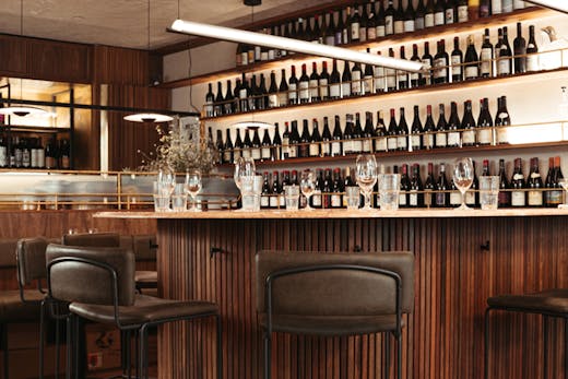 Bar stools surround the horseshoe shaped bar at Bar Heather in Byron Bay.