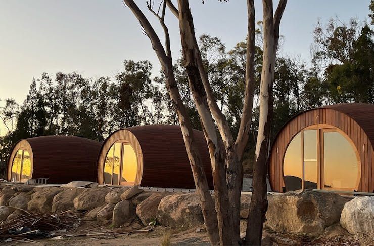three cabins shaped like wine barrels