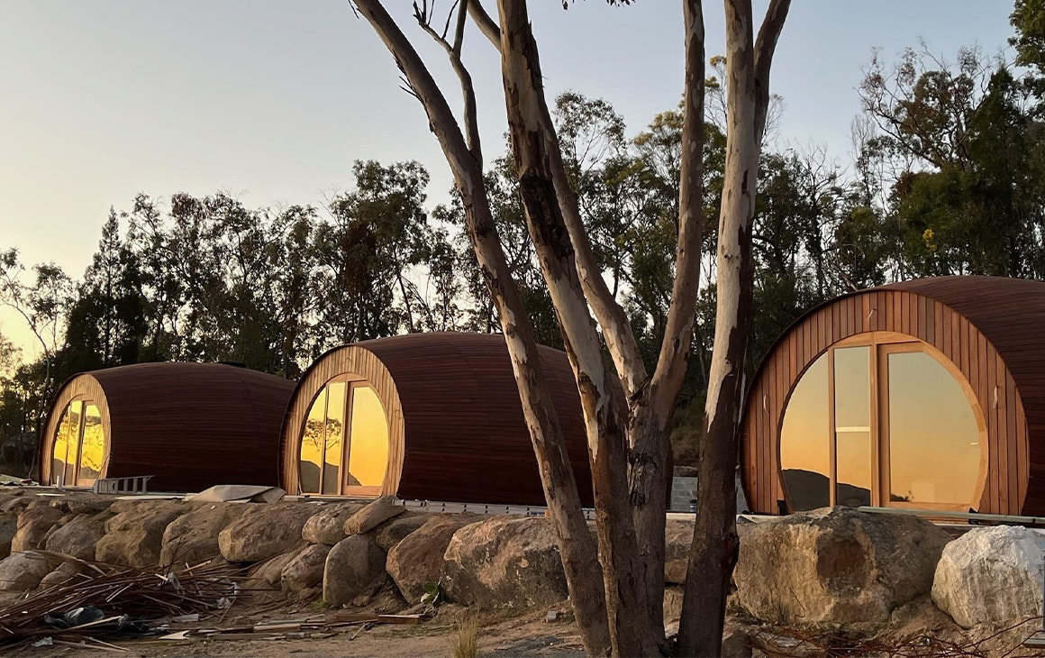 three cabins shaped like wine barrels