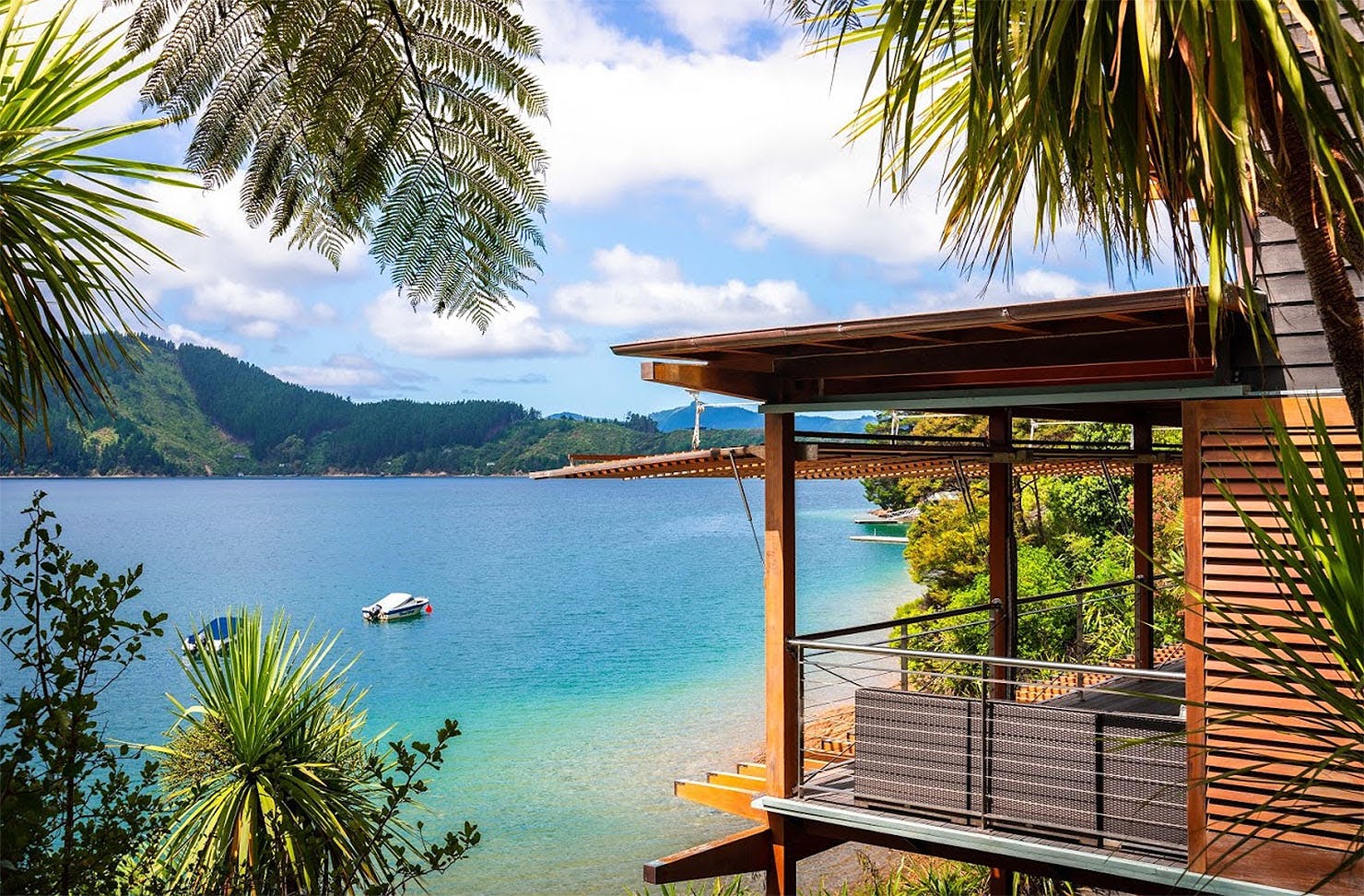 An idyllic vista looking out over blue, green water.