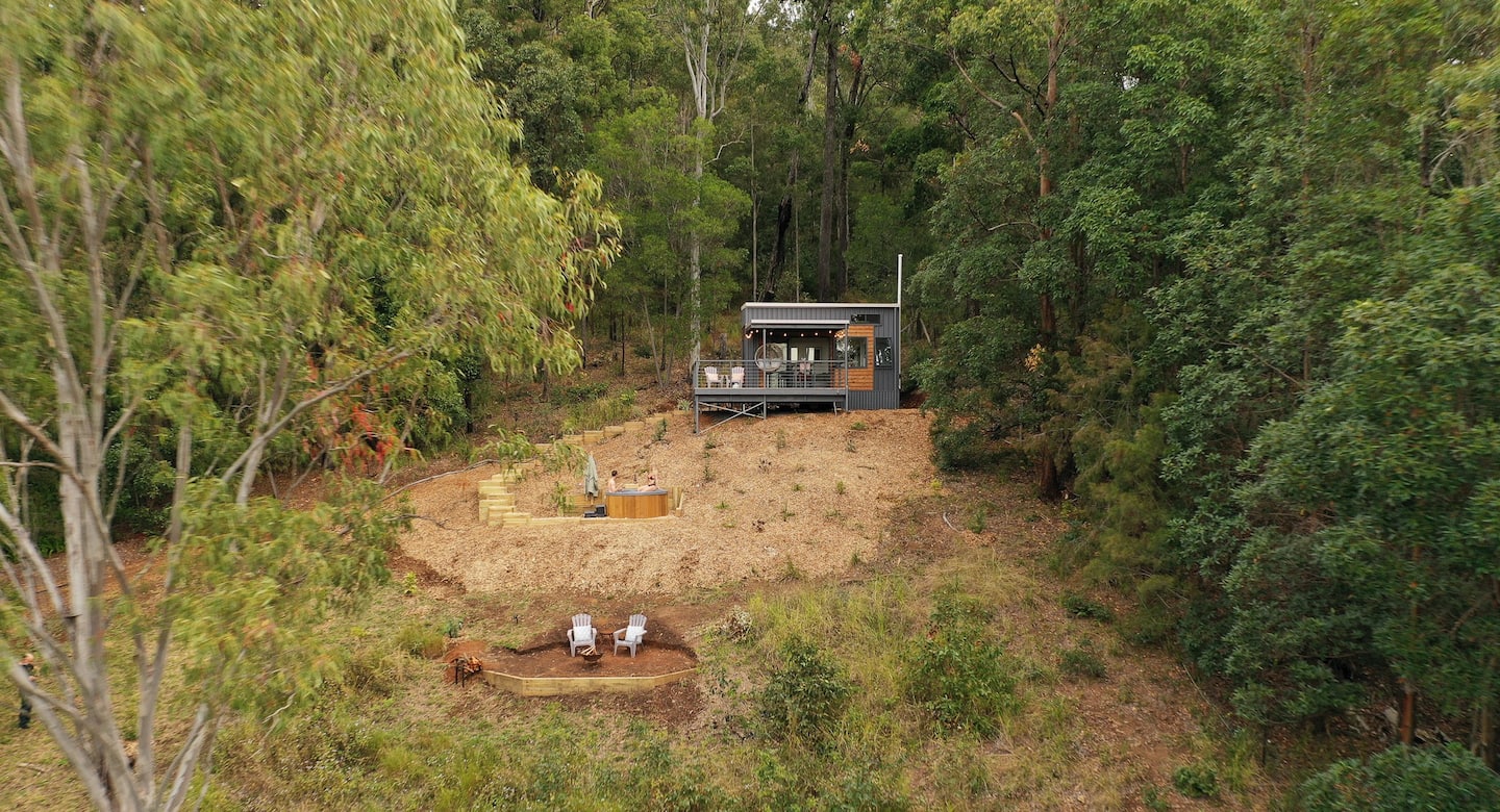 a tiny house with a hot tub seen from the air