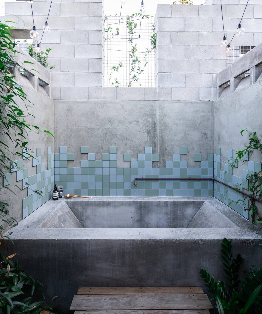 a stone bath out in a courtyard