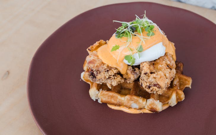 fried chicken eggs benny on a waffle