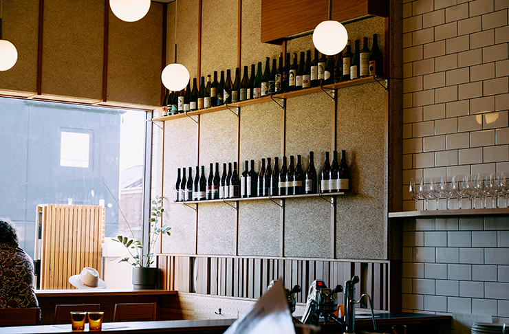 This is Waxflower, one of the best bars in melbourne with a wall lined with wine bottles, a large window drenching the bar in sunlight (during the day) and cosy nooks to prop up for a drink.