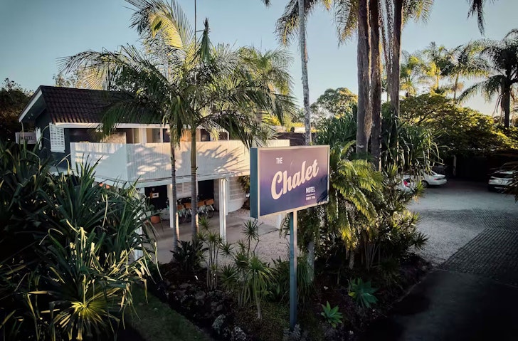 Palm trees surround The Chalet Motel, which is some of the best accommodation in Brunswick Heads. 