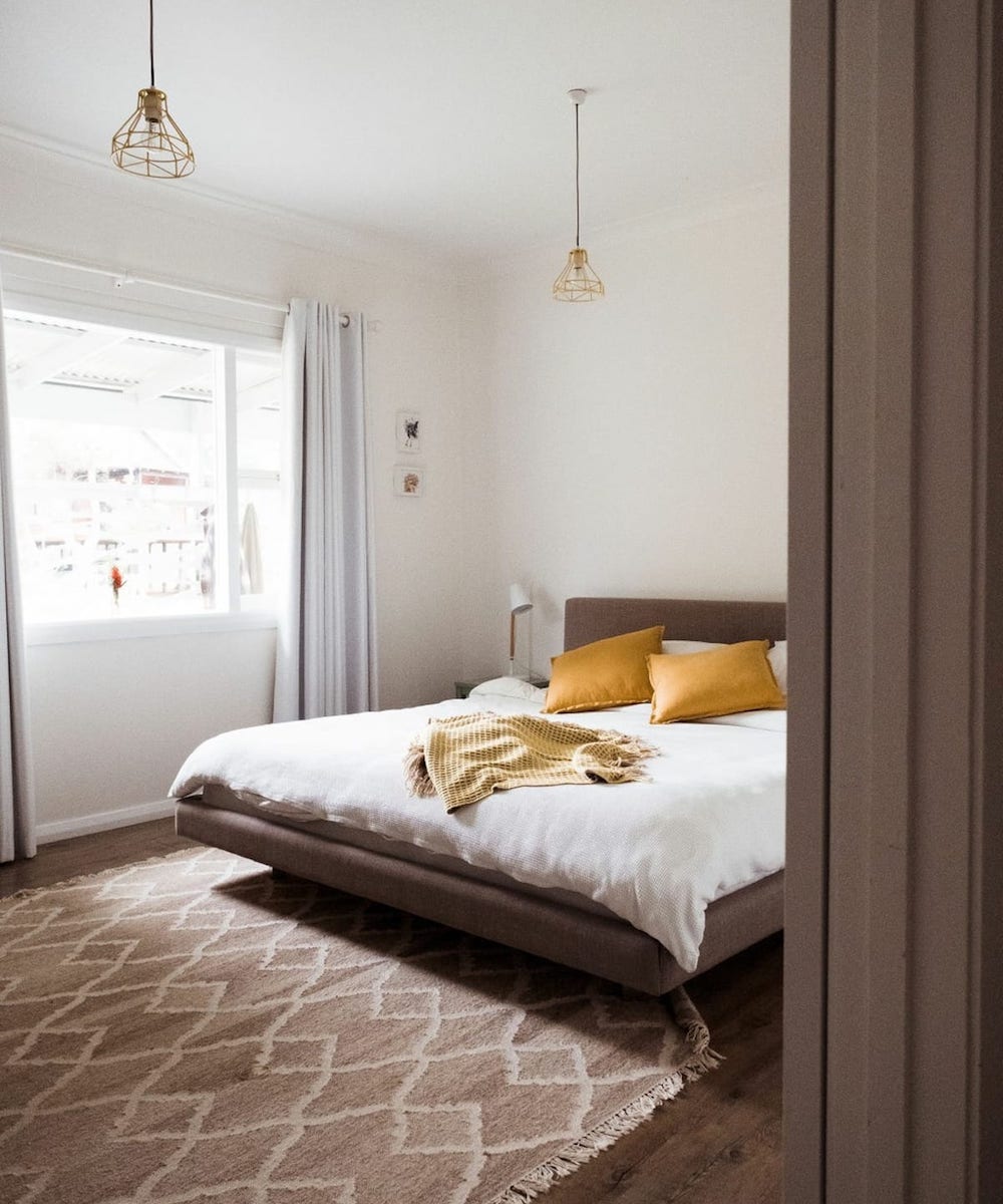 A beautiful neutral toned bedroom in an Airbnb in Denmark, WA