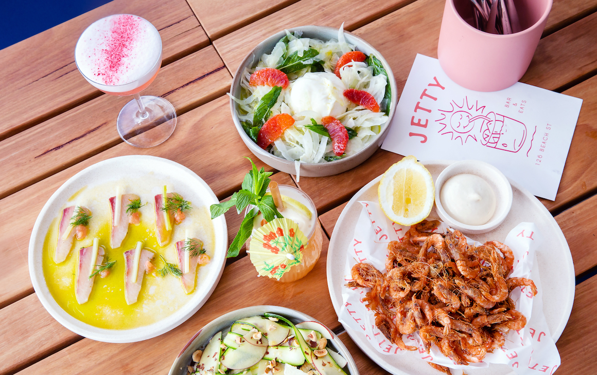 a table filled with shared plates and cocktails from Jetty bar And Eats in Fremantle