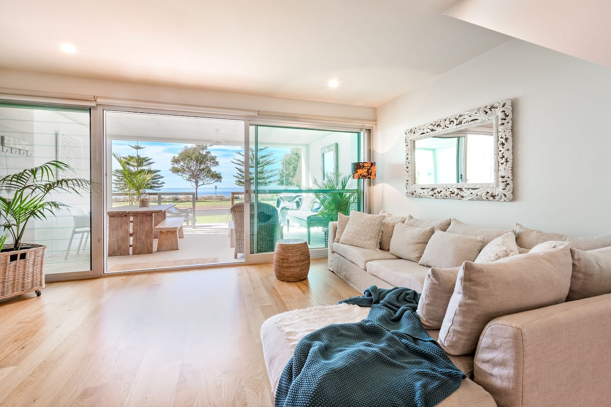 a coastal interior looking out to an ocean-front deck