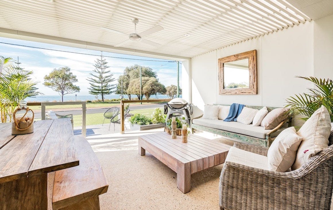 a wa beach house with an alfresco area that looks towards the beach