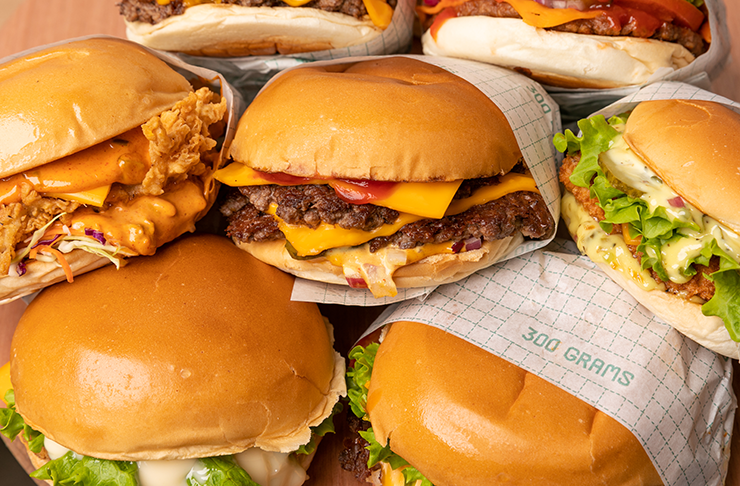 A stack of crispy fried chicken burgers from 300 Grams, one of the best burgers Melbourne is serving up for 2024.