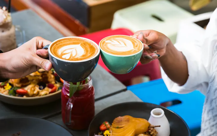 People enjoying coffee and breakfast at a Claremont cafe