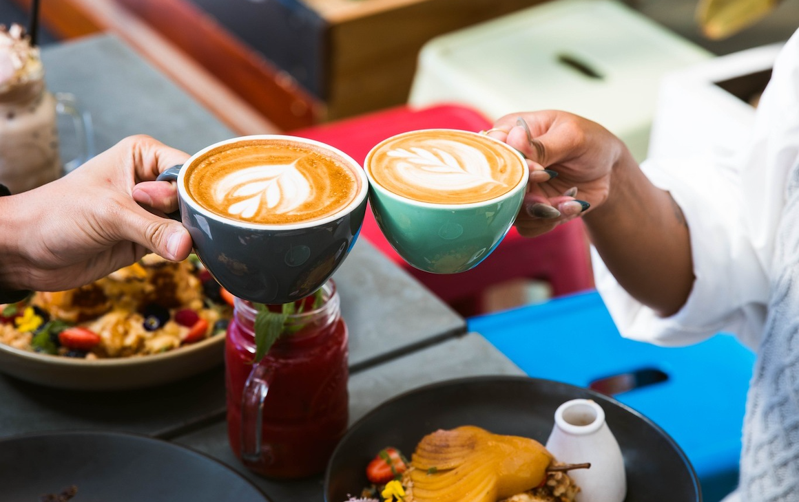 People enjoying coffee and breakfast at a Claremont cafe