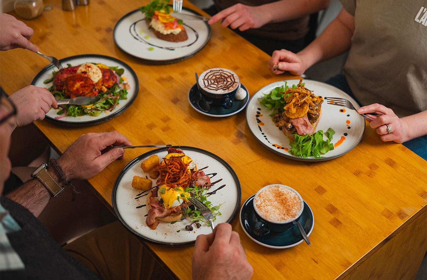 People sit down for a delicious feed at Little Rogue Eatery, one of the best cafes in New Plymouth.