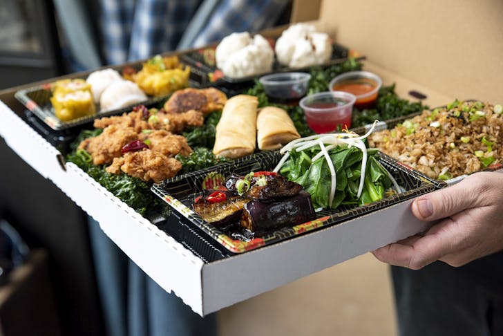 A takeaway box of Chinese from David's, one of the best Chinese restaurants in Melbourne. 