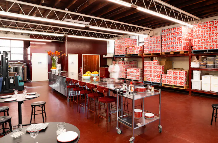 The red-hued tasting room at Ester Spirits, one of the best distilleries in Sydney