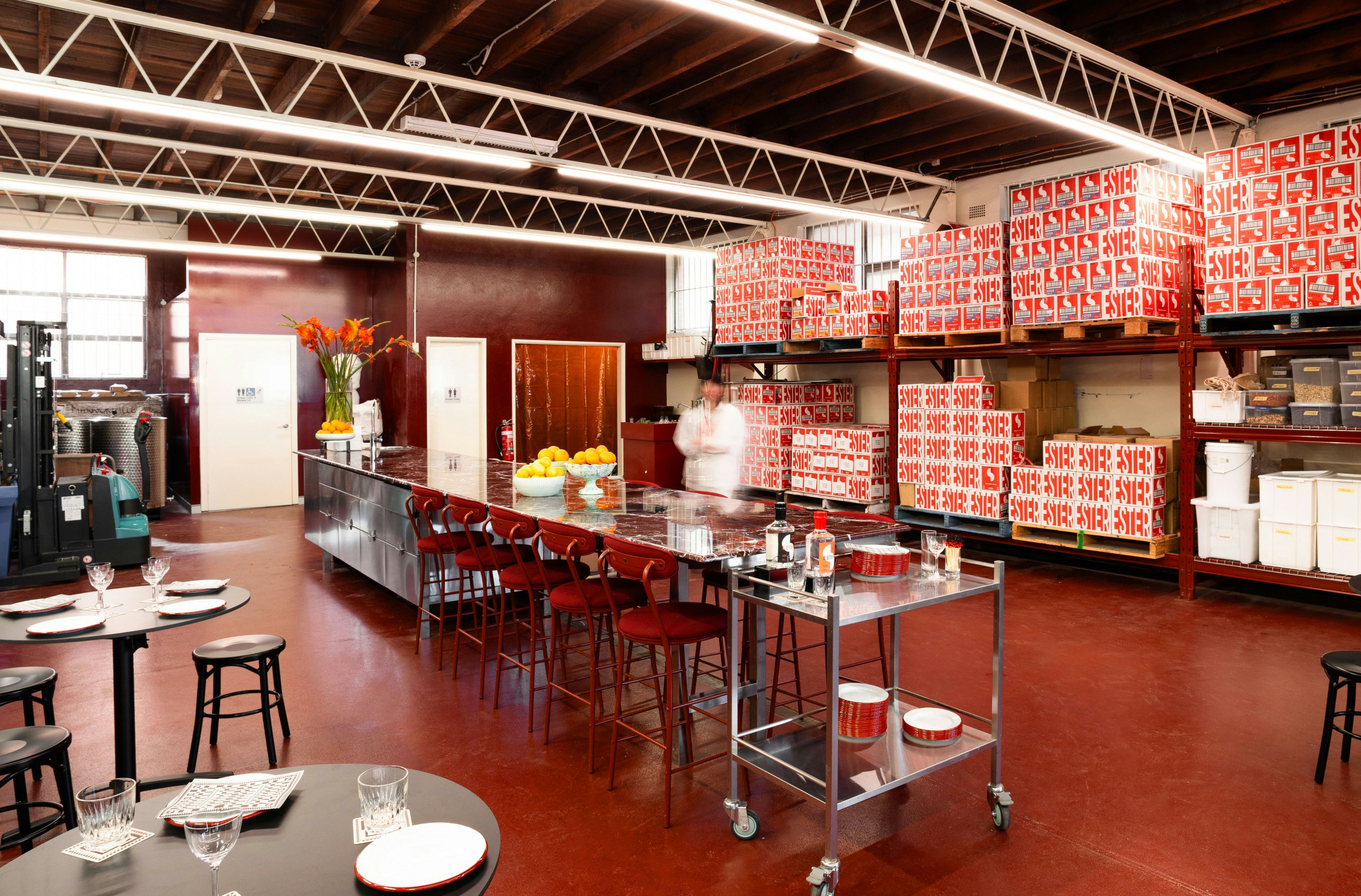 The red-hued tasting room at Ester Spirits, one of the best distilleries in Sydney
