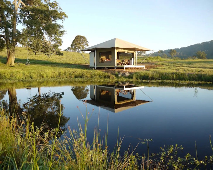 A glamping tent beside a lake in Maitland near Sydney