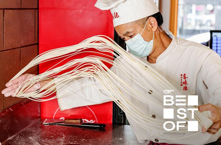 Someone creates the hand-pulled noodles at Jinweide in Auckland