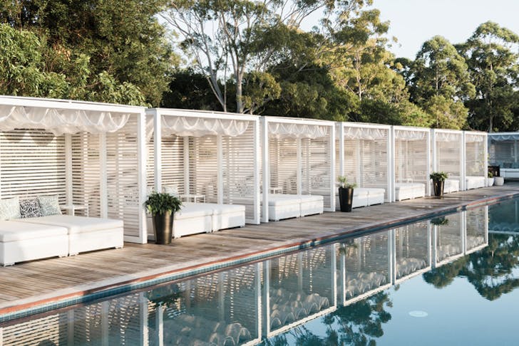 Cabanas surround the adults pool at the Elements of Byron Bay resort in regional NSW