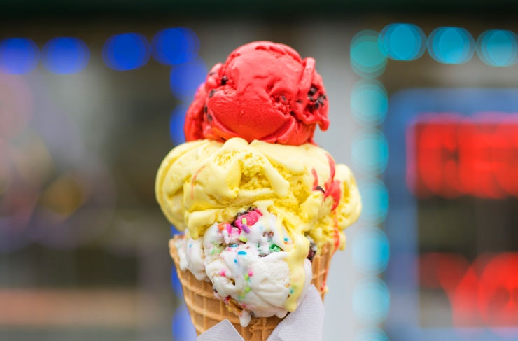 Three scoops of gelato piled into a cone. 