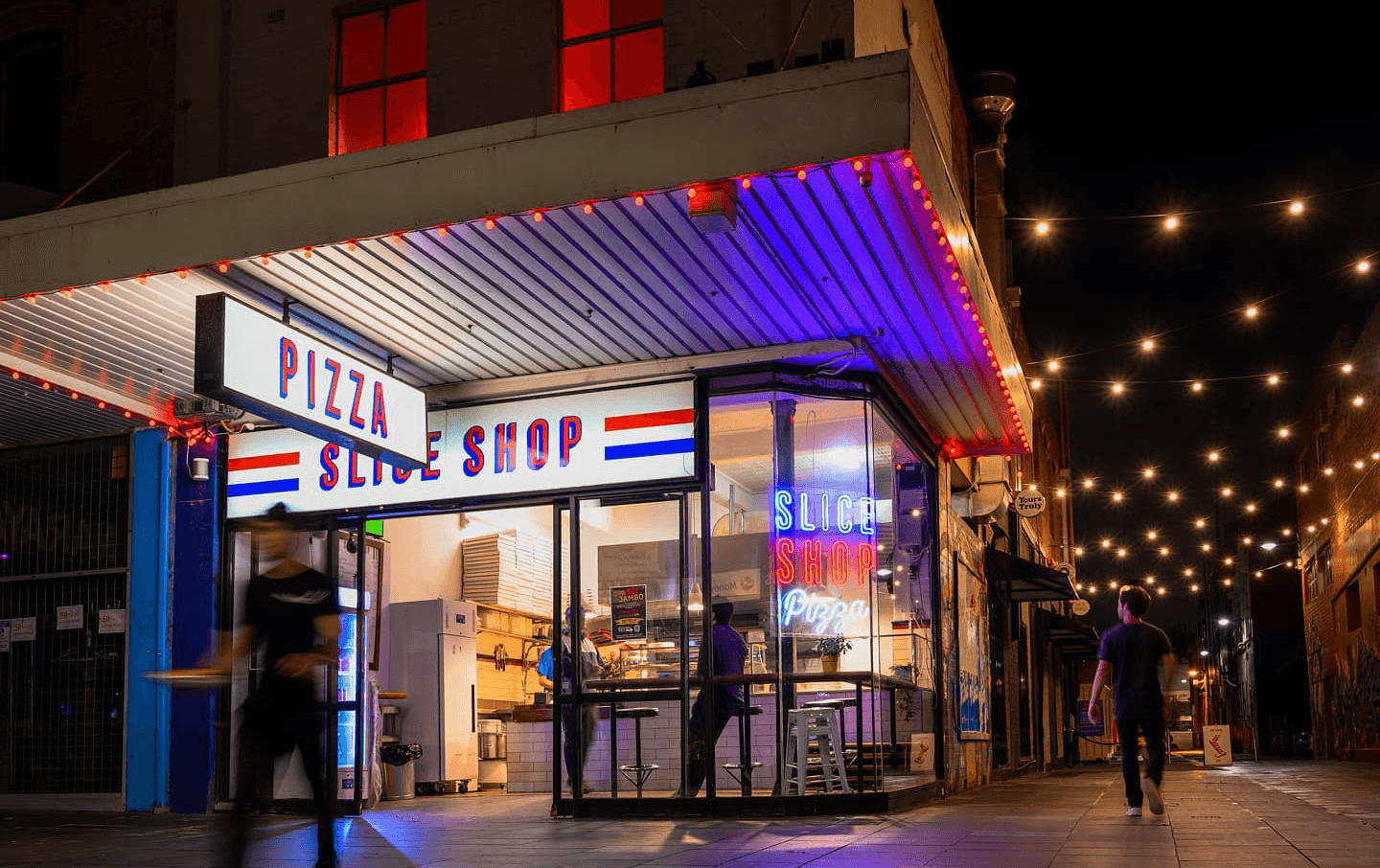 A neon-lit pizza spot called Slice Shop, who serve up some of Melbourne's best pizza.