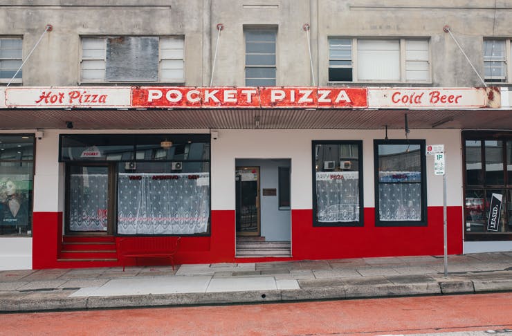 The red and white retro facade of Pocket Pizza in Brookvale
