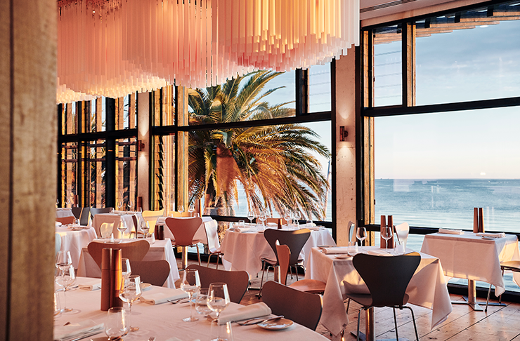 a golden hued restaurant over looking the beach in St Kilda, known as one of the best in Melbourne.