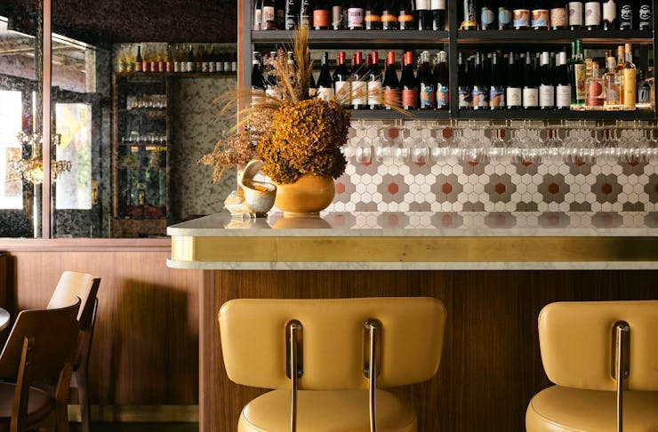Retro yellow bar stools at  the bar at Jane restaurant in Surry Hills. 