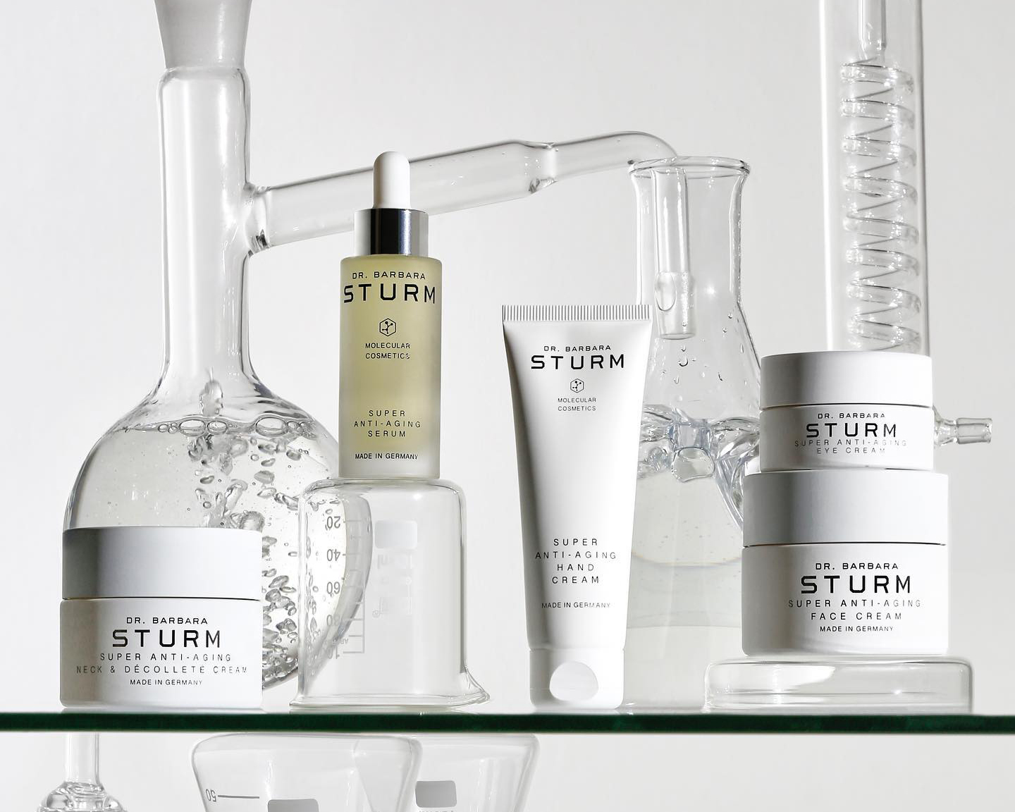 Dr Barbara Sturm's products with bunsen beakers in the background.